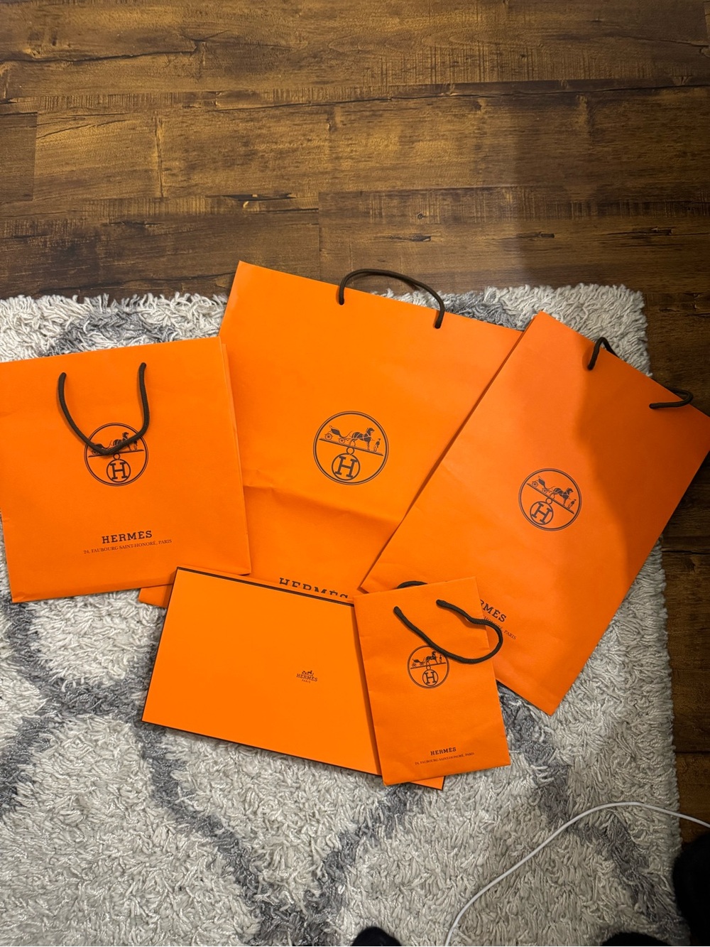 Hermes Orange Shopping Bags and Box Assortment with Black Handles